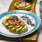 featured image of canned smoked wild coho salmon with avocado on toast.